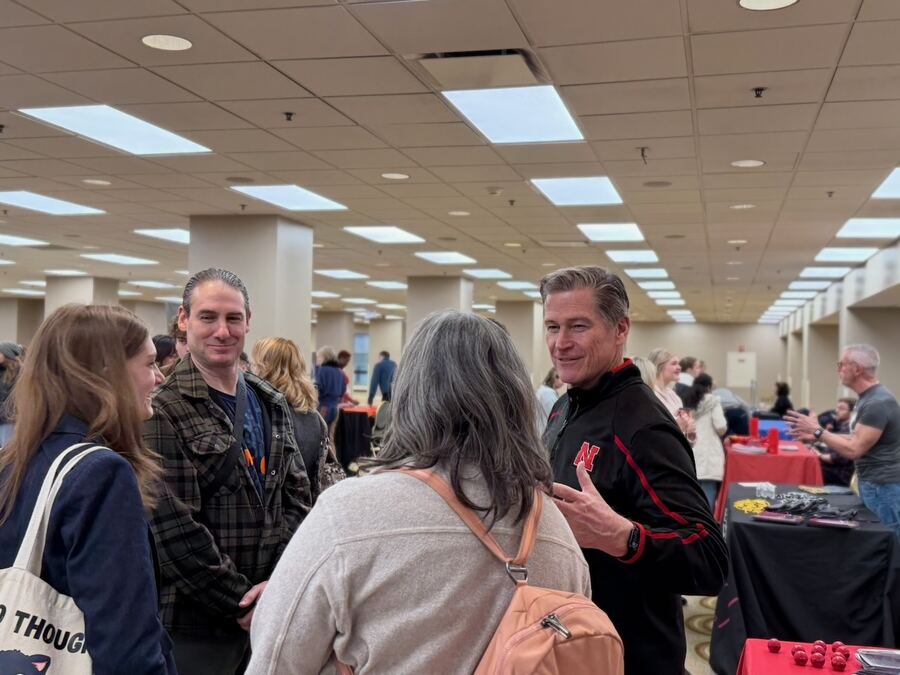 Parents and students talking with a school representative